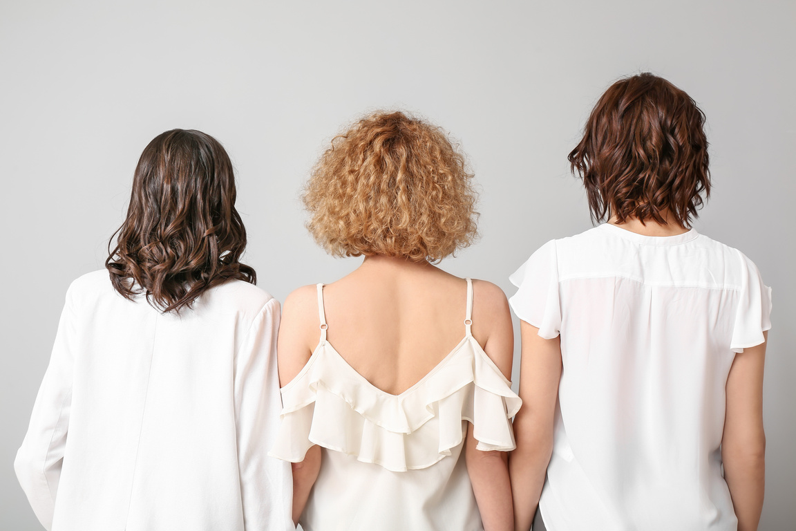 Young Women with Beautiful Short Hair on Grey Background